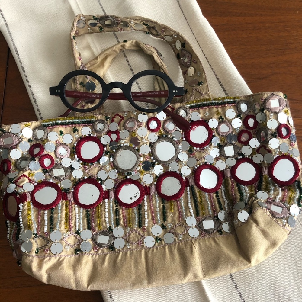 Mirror embroidered silk pouch bag.